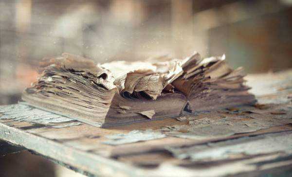 _278699042-stock-photo-old-torn-book-shabby-wooden.jpg