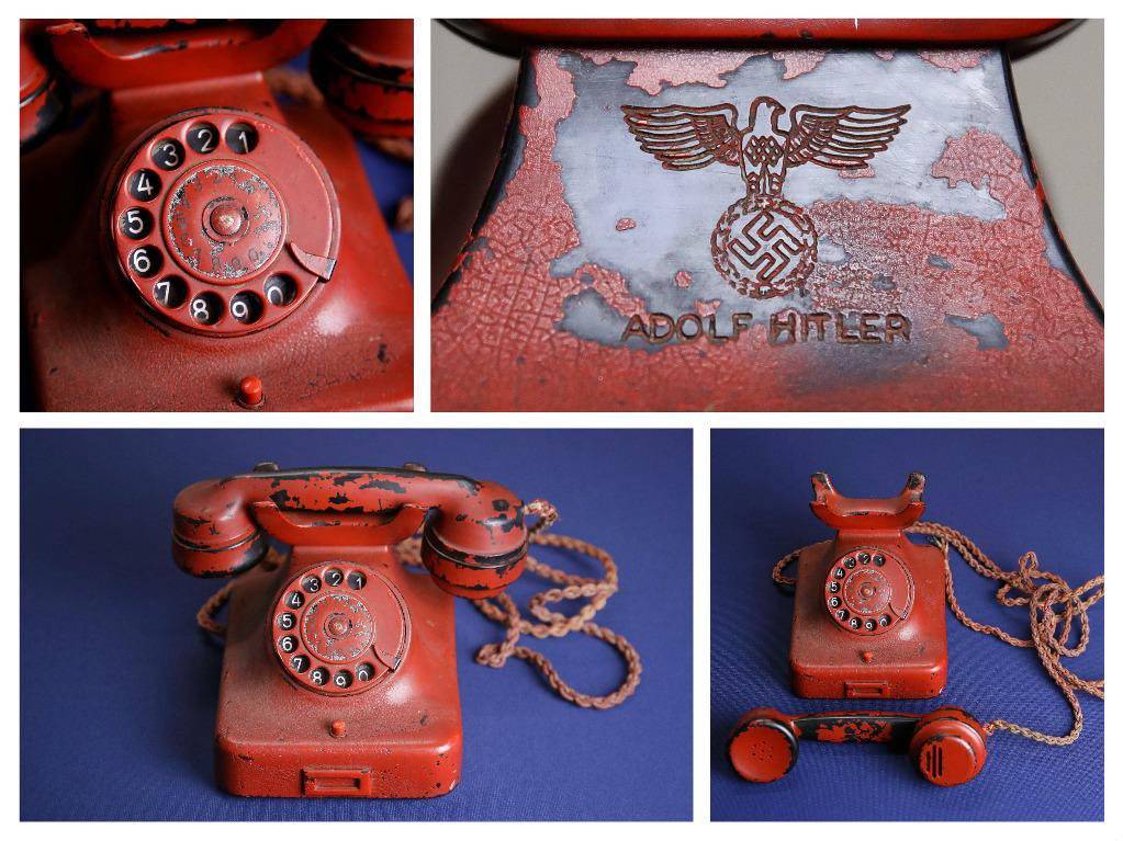  A photograph of Adolf Hitler's telephone, uncovered in his Berlin bunker after the regime's defeat in 1945, reveals an originally black Bakelite phone that was later painted red and engraved with Hitler's name.